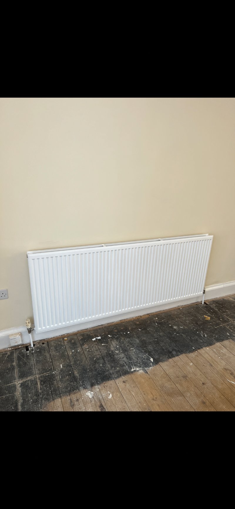 Same radiator with a clean, fresh white painted finish